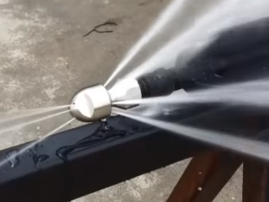 Hydro-Jetting Nozzle pushing out high pressure water